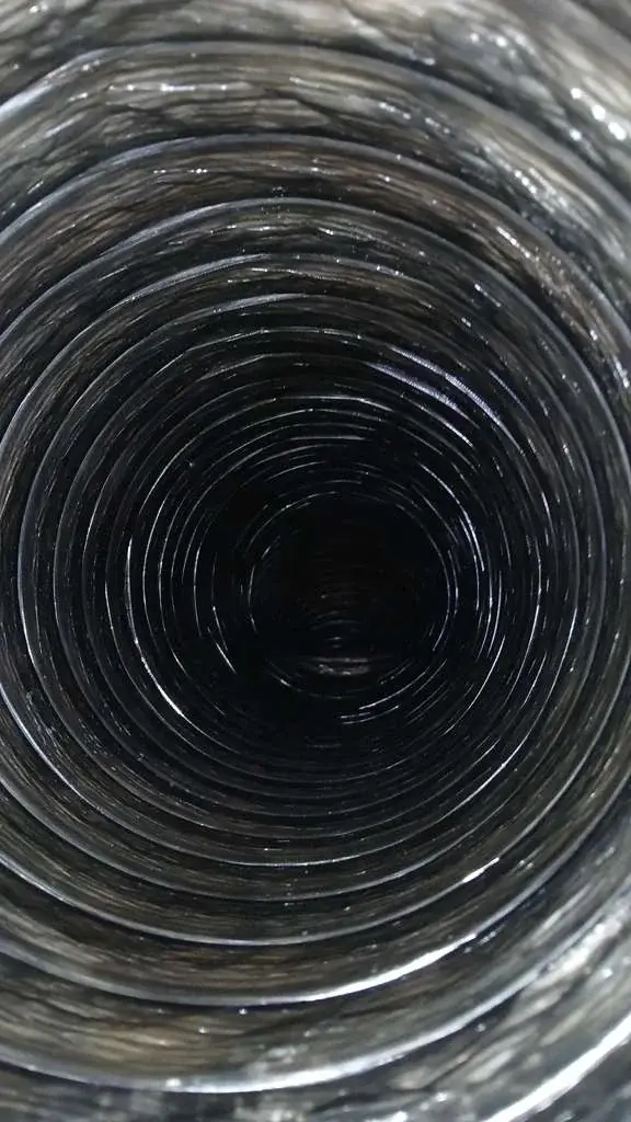 Why Does My House Get Dusty Right After I Clean? Duct Questions to Consider 2 dust and buildup visible inside residential ductwork, real company service photo 3