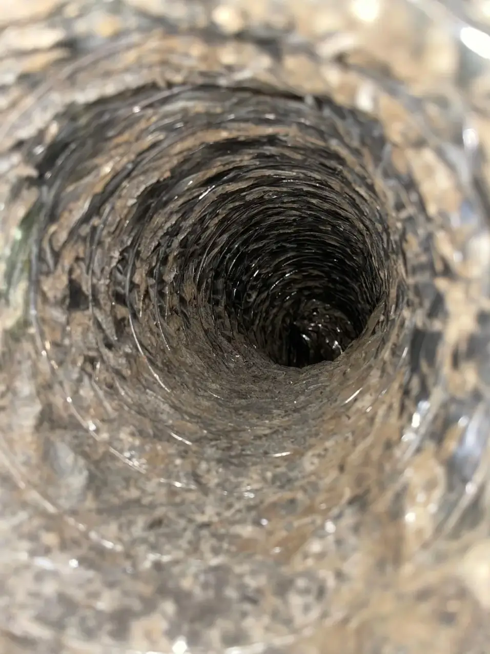 Why Does My House Get Dusty Right After I Clean? Duct Questions to Consider 5 dust and buildup visible inside residential ductwork, real company service photo 5